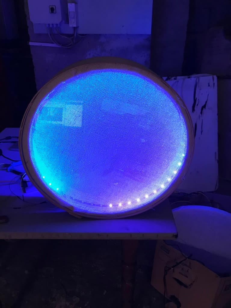 Jumi Käse Installation 2018 - First prototype A circled shaped object that diffuses blue LED lights coming from inside of the object